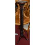 An early 20th century carved and spiral reeded mahogany pedestal plant stand, h.144cm