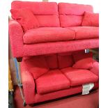 A contemporary red floral upholstered two-piece suite, comprising three-seater sofa and two-seater