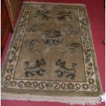 A Chinese green ground rug, the central ground decorated with dragons within trailing border, 190