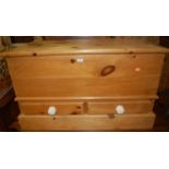 A modern pine hinge topped blanket box, having twin short lower drawers, w.96cm