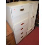 A contemporary white painted compactum, fitted with seven short drawers and twin cupboard doors, w.