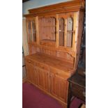A modern pine kitchen dresser, w.145.5cm