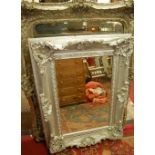 A contemporary floral decorated and silvered large rectangular wall mirror (with three sectional