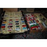 Four trays containing a quantity of boxed Lledo Days Gone and Matchbox Models of Yesteryear, to