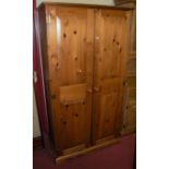 A modern pine double door wardrobe, w.95.5cm