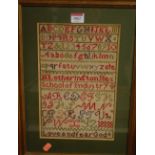 A needlework alphabet and word sampler, framed, 30 x 20cm