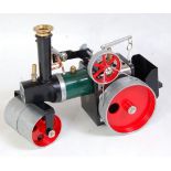 A Mamod SR1A loose steam roller, comprising of green, black and red body with base metal rollers,