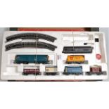 A Hornby train set containing green 'Iron Duke' engine and tender, 3 red cream coaches, track etc (