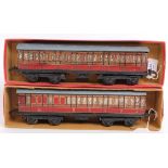 Two 1935-41 LMS passenger coaches, one each Br/3rd and 1st/3rd both have repainted roofs,