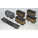 Six wagons and one loco tender; 4x Bassett-Lowke NE 12 ton vans paintwork crazed (G), one Bassett-