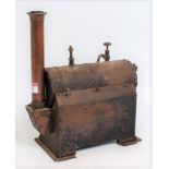 An early 20th century model of a tin housed and copper stationary steam boiler, comprising of copper