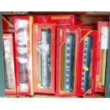 Tray containing 21 Triang and Hornby coaches, boxed and unboxed, mixed types, liveries and