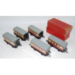 Five 1954-8 Hornby No.51 maroon and cream 4-wheel coaches. 1 x all/1 st ; 3 x all/3 rd & one pass