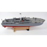 A scratch built balsa wood model of a PT109 Torpedo boat, comprising grey and red hull and