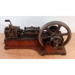 A very well made circa 1880 model of a live steam stationary horizontal mill engine, comprising of