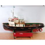 A very well made wooden and vac form hulled model of a Sea Trojan tug boat, suitable for use for