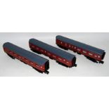 Three Lionel coaches for Hogwarts Express, all equipped with internal lighting, running numbers