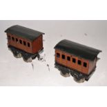 Two Hornby 1920-6 GNR tinprinted 4-wheel coaches, nickel wheels, thin axles, one coupling missing