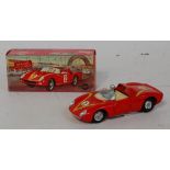 A Mercury No. 57 Ferrari Monza racing car comprising red body with cream interior, driver figure and