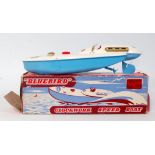 A Sutcliffe Models tinplate and clockwork model of a Bluebird Speedboat, finished in white and blue,