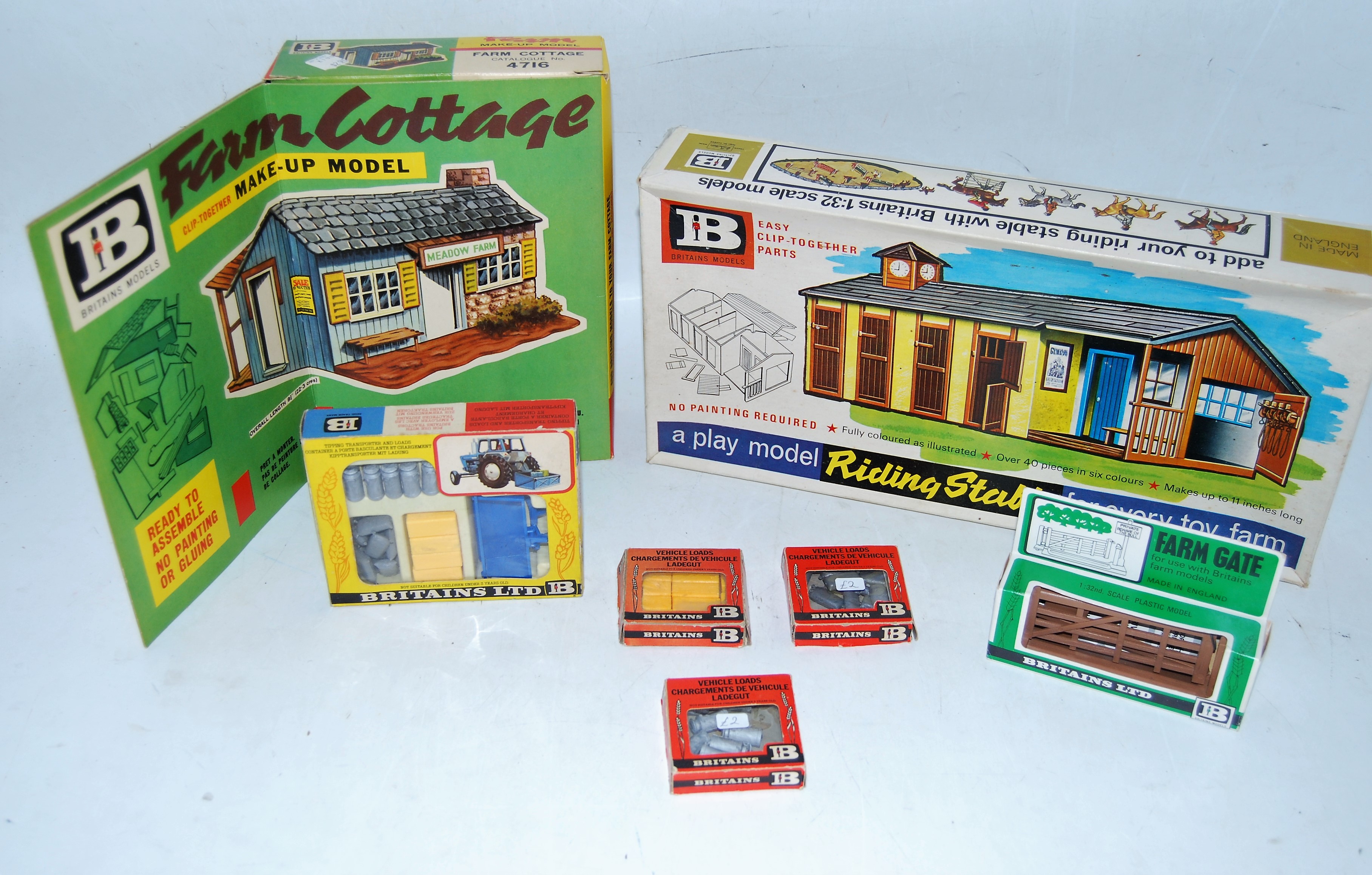 A collection of various boxed Britains farm building series and farm accessories to include No. 4716