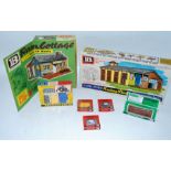 A collection of various boxed Britains farm building series and farm accessories to include No. 4716