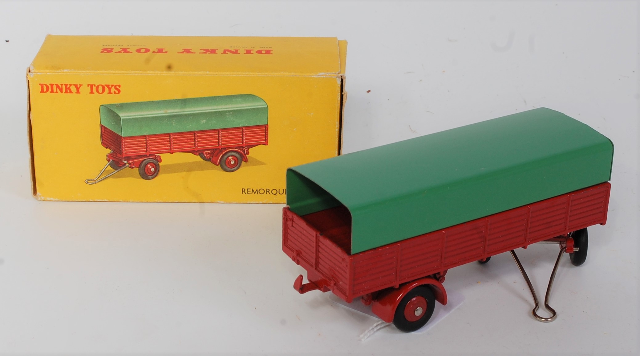 A French Dinky Toys No. 70 Remorque Bachee covered draw bar trailer, comprising of dark base and