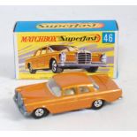 A Matchbox Superfast No. 46 Mercedes Benz 300 SE comprising metallic orange body with cream