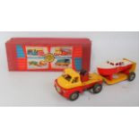 A Wells Brimtoy No. 707 tinplate and clockwork boat carrier comprising Bedford style tinplate and