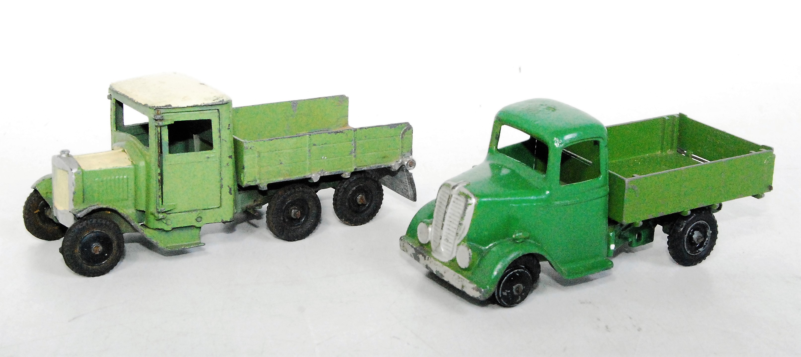 A Britains repainted and partly restored tipper group to include a Britains No. 60F six wheel tipper
