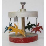 A 1940s Spira Chase racing game, cast alloy mechanical carousel, hand operated example with plunge