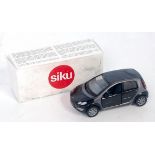 A Siku Smart For Four production sample, comprising black body with grey interior, housed in the