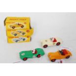 Three various boxed Dinky Toy sports car and racing cars, all boxes with some minor damage to