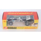 A Corgi Toys No. 150 Surtees TS9 F1 racing car, comprising of dark metallic blue and white body with