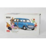 A Sunstar limited edition 1/12 scale model of a 1960 Morris Mini Traveller finished in blue, limited