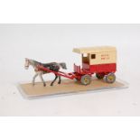 A Charbens 1950s repainted model of a lead horsedrawn Hovis Bread delivery cart, comprising red