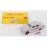 A Dinky Toys No. 176 Austin A105 saloon comprising of grey body with red racing stripe and red hubs,