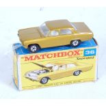 A Matchbox No. 36 Opel Diplomat comprising of metallic gold body with white interior and five