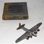 A Dinky Toys No. 62G Boeing Flying Fortress Monoplane comprising of silver body with 4x3 red blade