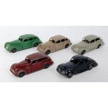 Five various loose Dinky Toy playworn saloons to include No. 39E Chrysler finished in green, a No.