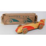 A Chad Valley Harborne large clockwork racing car model No. 10003 comprising of peach and orange