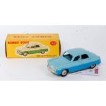 A Dinky Toys No. 162 Ford Zephyr saloon comprising of two-tone blue body with grey hubs, housed in