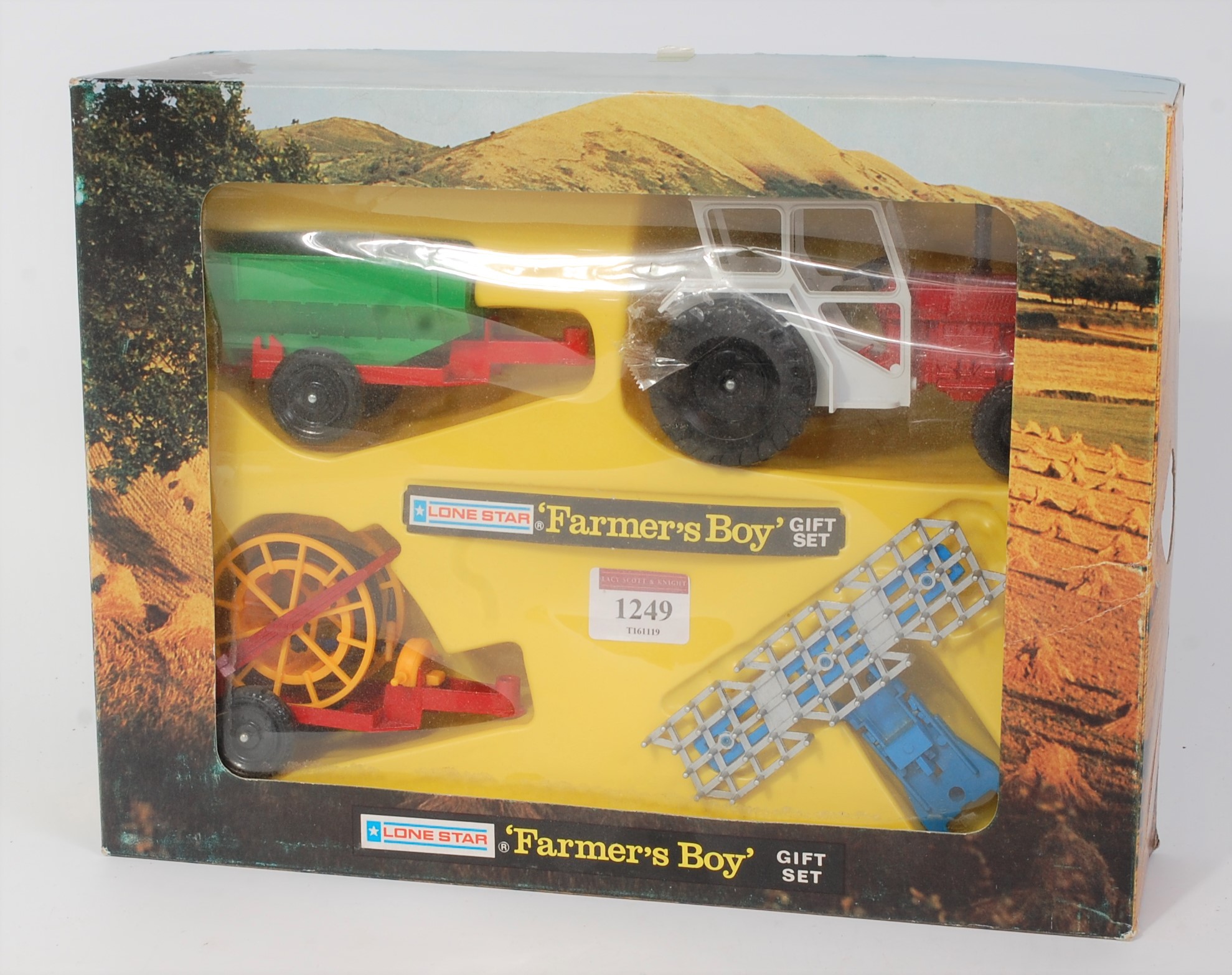 A Lonestar No. 1741 Farmers Boy gift set comprising of International Tractor with three various