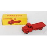 A Dinky Toys No. 422 Fordson Thames flat truck comprising of all red body with matching hubs, in the