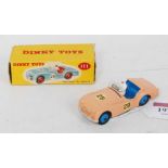 A Dinky Toys No. 111 Triumph TR2 sports car comprising of salmon pink body with blue interior and