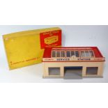 A Dinky Toys No. 785 Service Station moulded kit comprising cream and red body with clear glazing