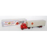 A Dinky Toys No. 948 McLean articulated tractor and trailer comprising red cab and chassis with grey