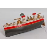 A Staudt early 20th century circa 1910 model of a tinplate and clockwork gunboat, model appears to