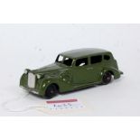 A Dinky Toys No. 39A Packard Super Eight saloon comprising of dark green body with silvered grille