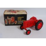 A Pippin Toys large scale plastic model of a Nuffield tractor, comprising of red body with